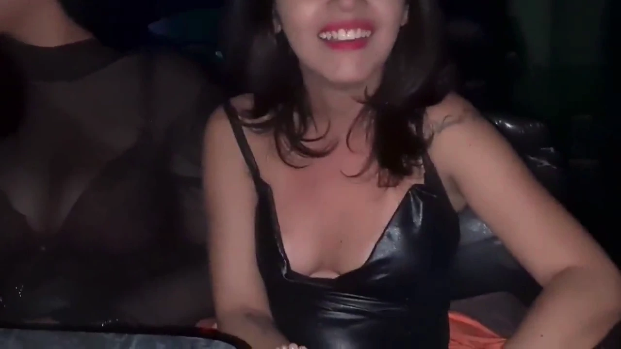 A slender young woman engages in a steamy encounter at the swinger's club, passionately riding a man's shaft porn video
